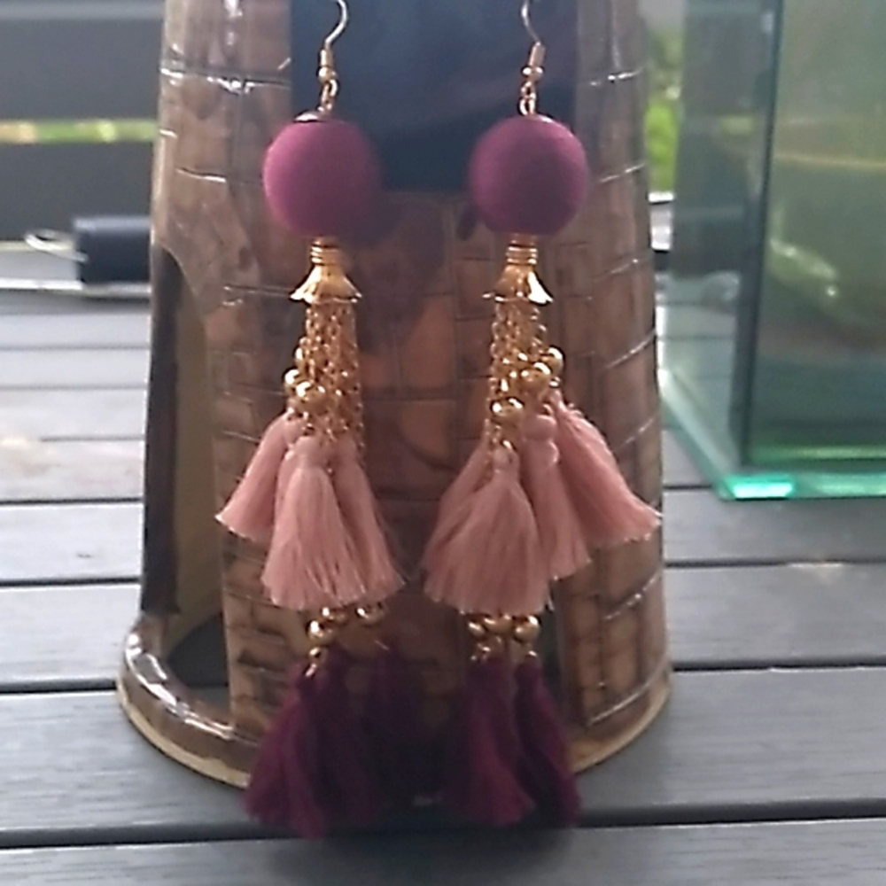 Amazing Earrings.   Blush and dark reddish purple tassels.   Hangs 5 1/2".